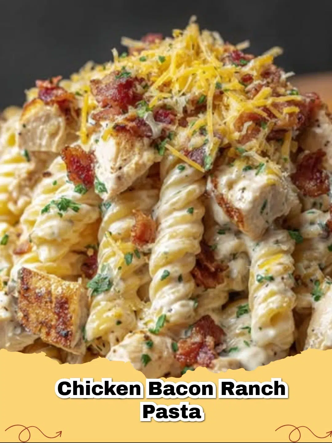 Creamy Chicken Bacon Ranch Pasta in a white bowl, garnished with fresh parsley and extra bacon bits.