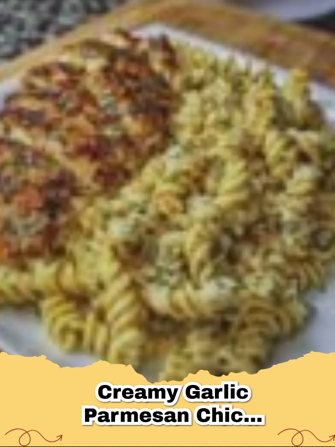 A close-up of a bowl of Creamy Garlic Parmesan Chicken Pasta, garnished with fresh parsley.