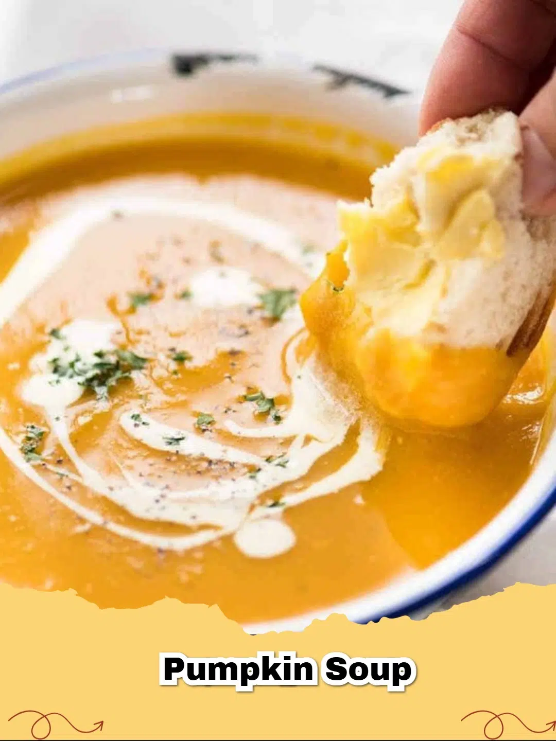 A bowl of creamy homemade pumpkin soup garnished with fresh sage and toasted pumpkin seeds.