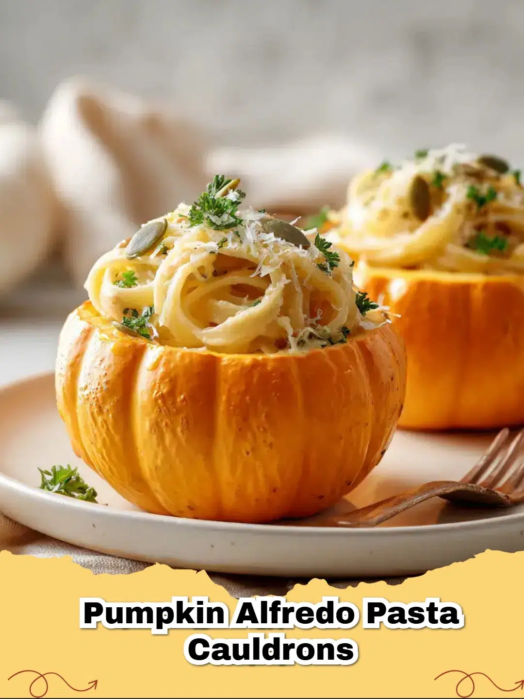 Creamy Pumpkin Alfredo Pasta served in mini roasted pumpkin cauldrons, garnished with fresh parsley and pepitas.