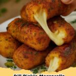 Crispy golden dill pickle mozzarella sticks with a gooey cheese pull, served with dipping sauce.