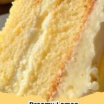 Delicious slice of Lemon Cheesecake Cake with creamy cream cheese frosting, garnished with lemon zest