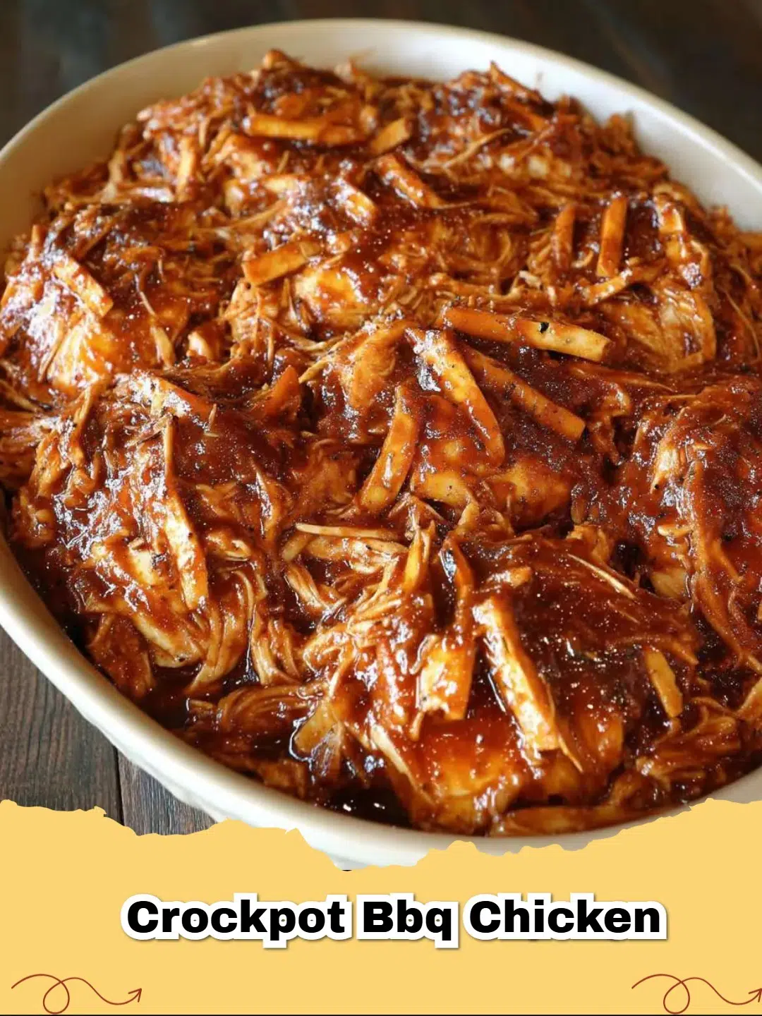 Deliciously tender Crockpot BBQ Chicken piled high on a bun with a side of coleslaw, ready to serve for dinner.