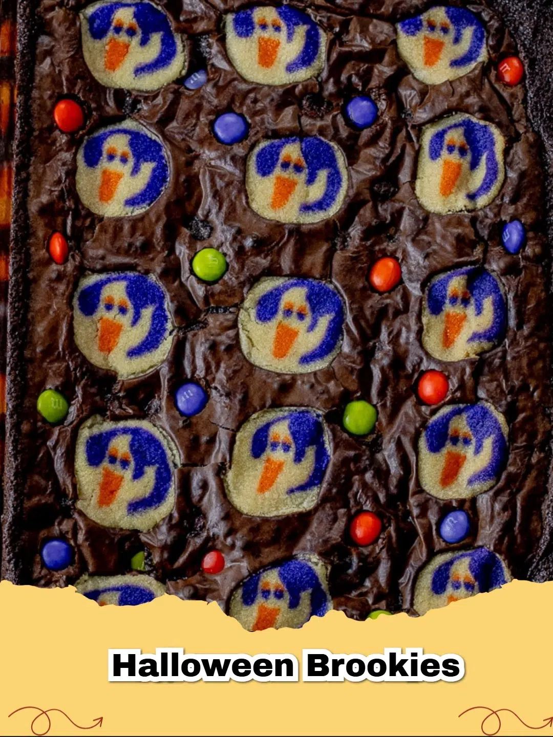 Easy Halloween Brookies with ghost cookies and M&M's on a festive platter