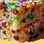 A slice of vibrant Easy Homemade Funfetti Cake with colorful sprinkles and creamy frosting.