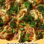 Crispy oven-baked dumplings served with a side of creamy, spicy peanut dipping sauce, garnished with green onions and sesame seeds.