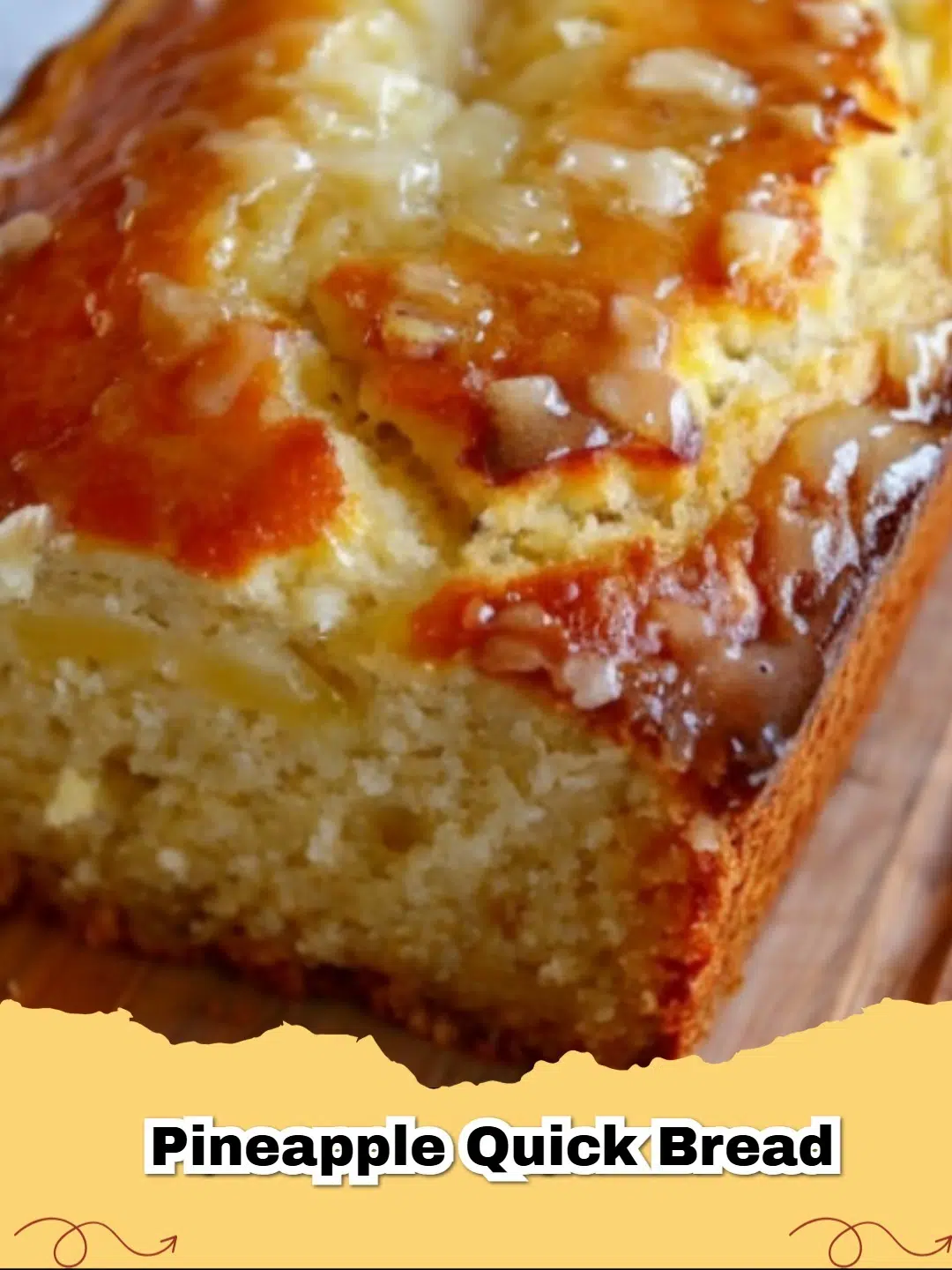 A slice of moist pineapple quick bread with a golden-brown crust and visible pineapple chunks, ready to be enjoyed.