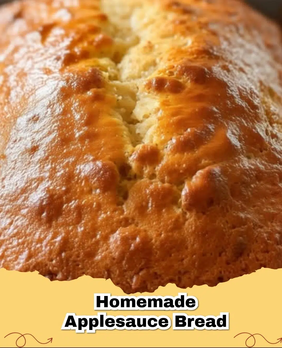 Deliciously moist easy spiced applesauce bread loaf on a cutting board, garnished with powdered sugar.