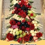 A beautifully arranged Festive Christmas Sweet Grazing Board featuring cookies, chocolates, fruits, and candies, perfect for holiday gatherings.