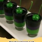 Frankenstein's Lab Shots with black sugar rim and green cherry garnish, perfect for a spooky Halloween party