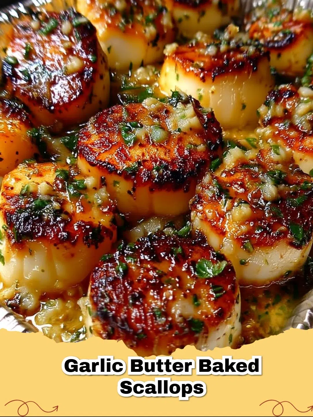 Close-up of golden-brown garlic butter baked scallops in a white dish, garnished with fresh parsley and lemon wedges.