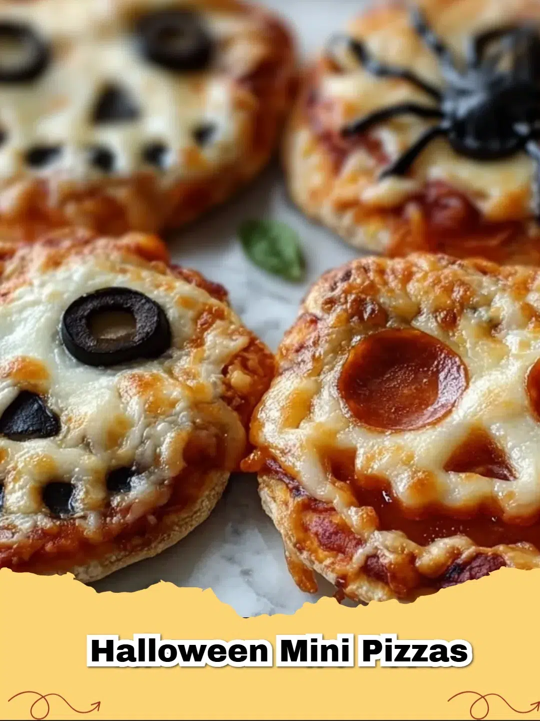 Close-up of Ghost and Pumpkin Halloween Mini Pizzas on a cutting board, garnished with olive eyes and bell pepper pumpkins.