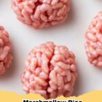 Close-up of spooky Halloween Brain Rice Krispie Treats on a black platter, showing red veins.