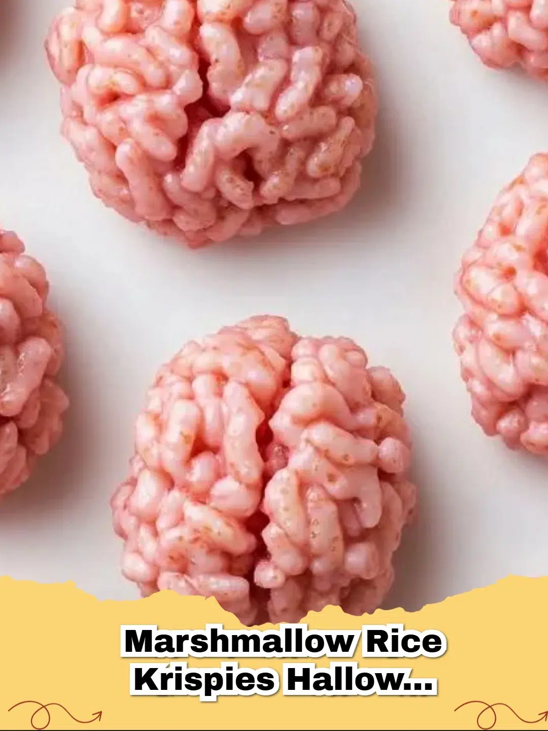 Close-up of spooky Halloween Brain Rice Krispie Treats on a black platter, showing red veins.