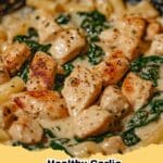 A close-up of a bowl of Healthy Garlic Parmesan Chicken Pasta Recipe with fresh parsley, ready to eat.
