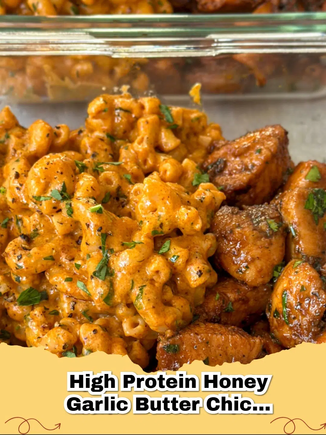 A close-up shot of High Protein Honey Garlic Butter Chicken served with creamy, golden Mac & Cheese on a white plate, garnished with fresh parsley.