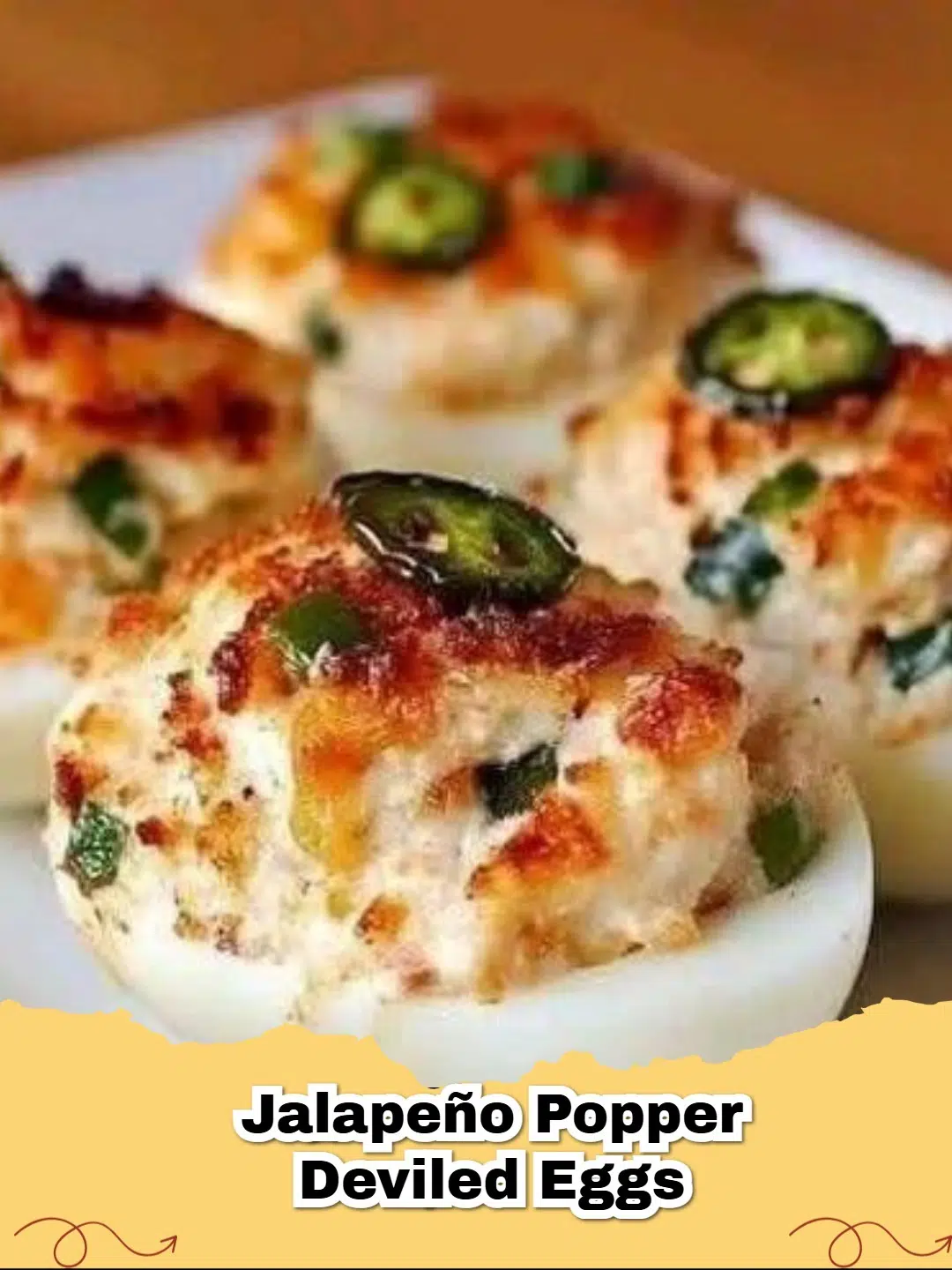 Platter of creamy Jalapeño Popper Deviled Eggs garnished with jalapeño slices and paprika, perfect for a party