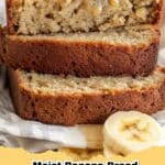 A perfectly baked loaf of moist banana bread sliced on a wooden board, showcasing its tender crumb and golden crust, featuring the primary keyword moist banana bread.
