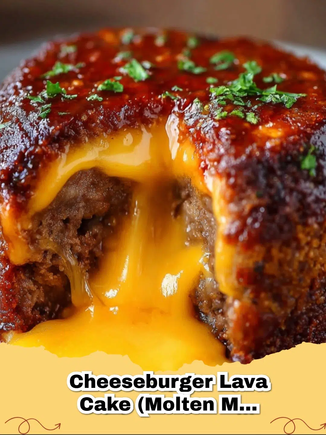 A baked Molten Cheeseburger Lava Cake cut open, revealing gooey melted cheddar cheese spilling out onto a bun with fresh toppings.