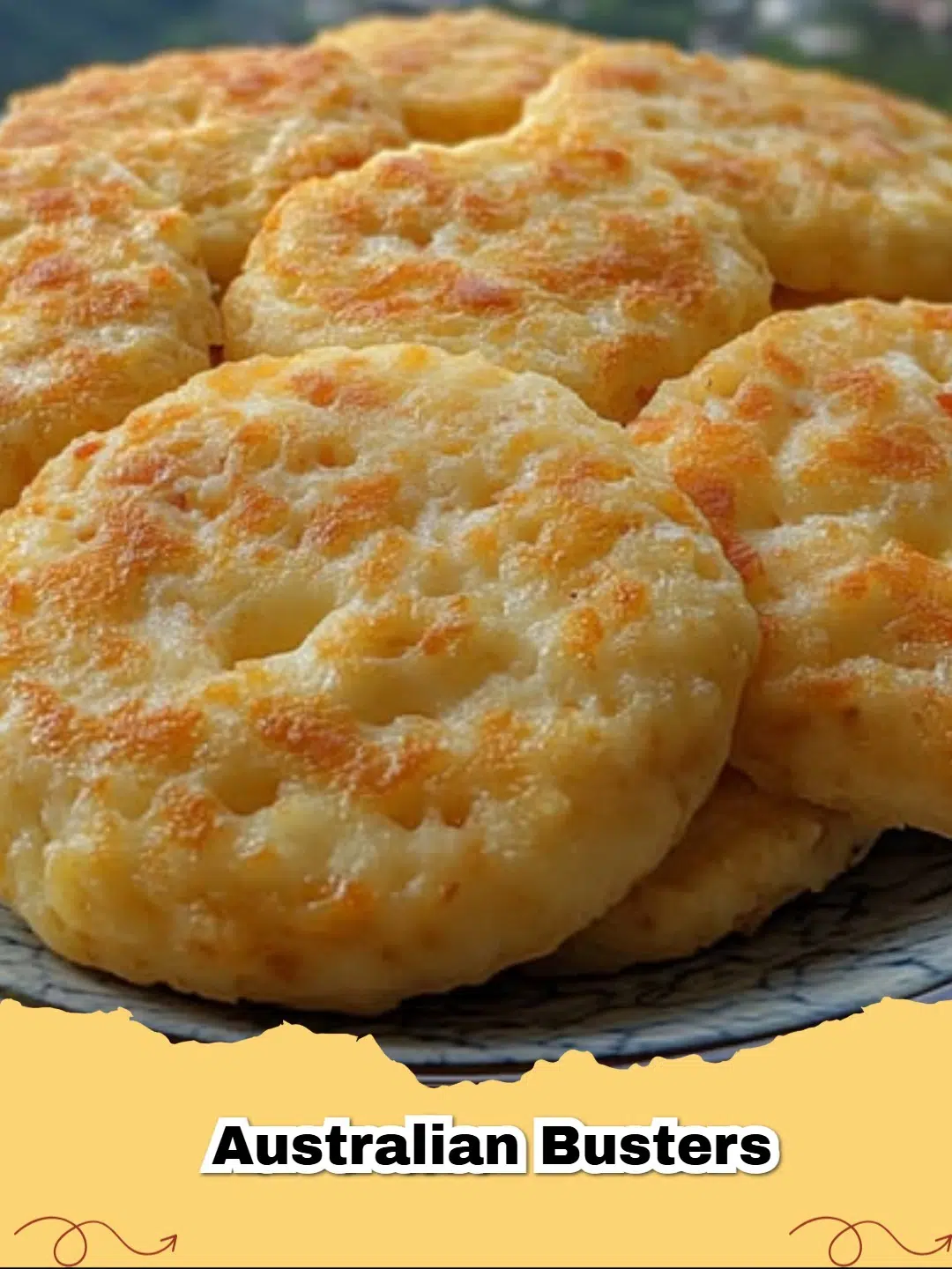 A plate of sliced No-Bake Australian Busters, showing the chocolate coconut topping and biscuit base, perfect for an Australian treat.