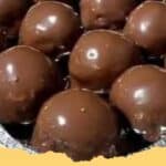 Close-up of easy no-bake peanut butter balls with some coated in chocolate and some plain, on a white plate.