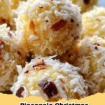 Festive No-Bake Pineapple Coconut Christmas Balls on a white platter, garnished with coconut flakes and red cherries, ready for holiday serving.