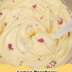 A close-up of light and airy No-Bake Sugar-Free Lemon Raspberry Cheesecake Fluff in a glass dish, garnished with fresh raspberries and a lemon slice.