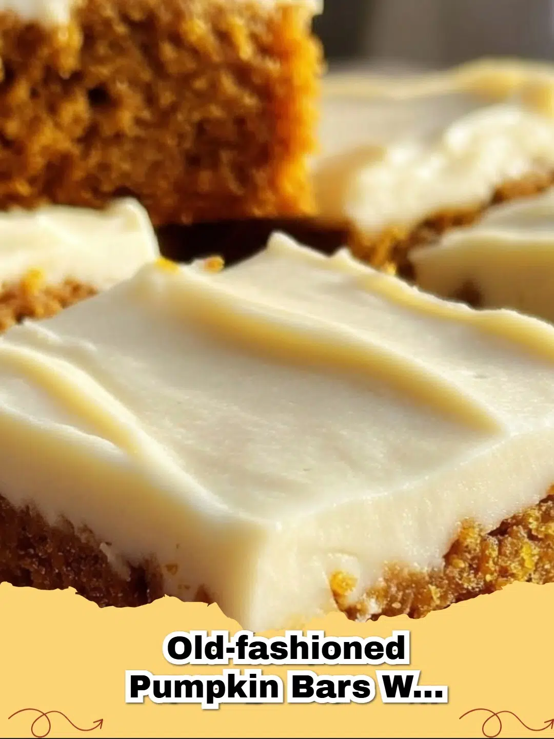 Delicious old-fashioned pumpkin bars with thick cream cheese frosting on a cooling rack