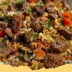 A steaming One-Pan Savory Seasoned Ground Beef and Rice Skillet topped with fresh cilantro, ready to serve.
