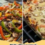 Philly Cheesesteak Casserole in a baking dish, topped with golden melted provolone cheese and fresh parsley.