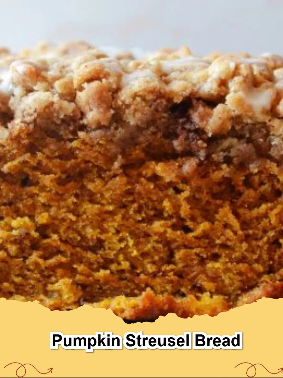 Delicious homemade Pumpkin Streusel Bread with a golden-brown crumbly topping, ready to serve for a fall treat.