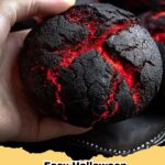 Dramatic red and black Halloween Brimstone Bread on a rustic wooden board, perfect for spooky parties.