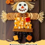 A festive Scarecrow Harvest Board filled with fall cheeses, fruits, nuts, and crackers, perfect for autumn entertaining.