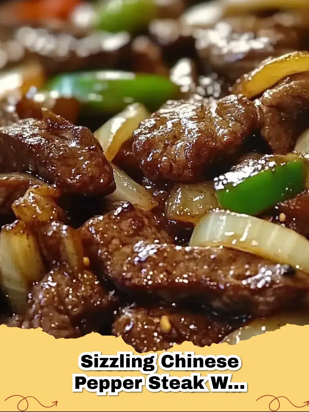 Platter of Sizzling Chinese Pepper Steak with Onions, featuring tender beef slices, green and red bell peppers, and sweet onions coated in a rich brown sauce, served over rice.