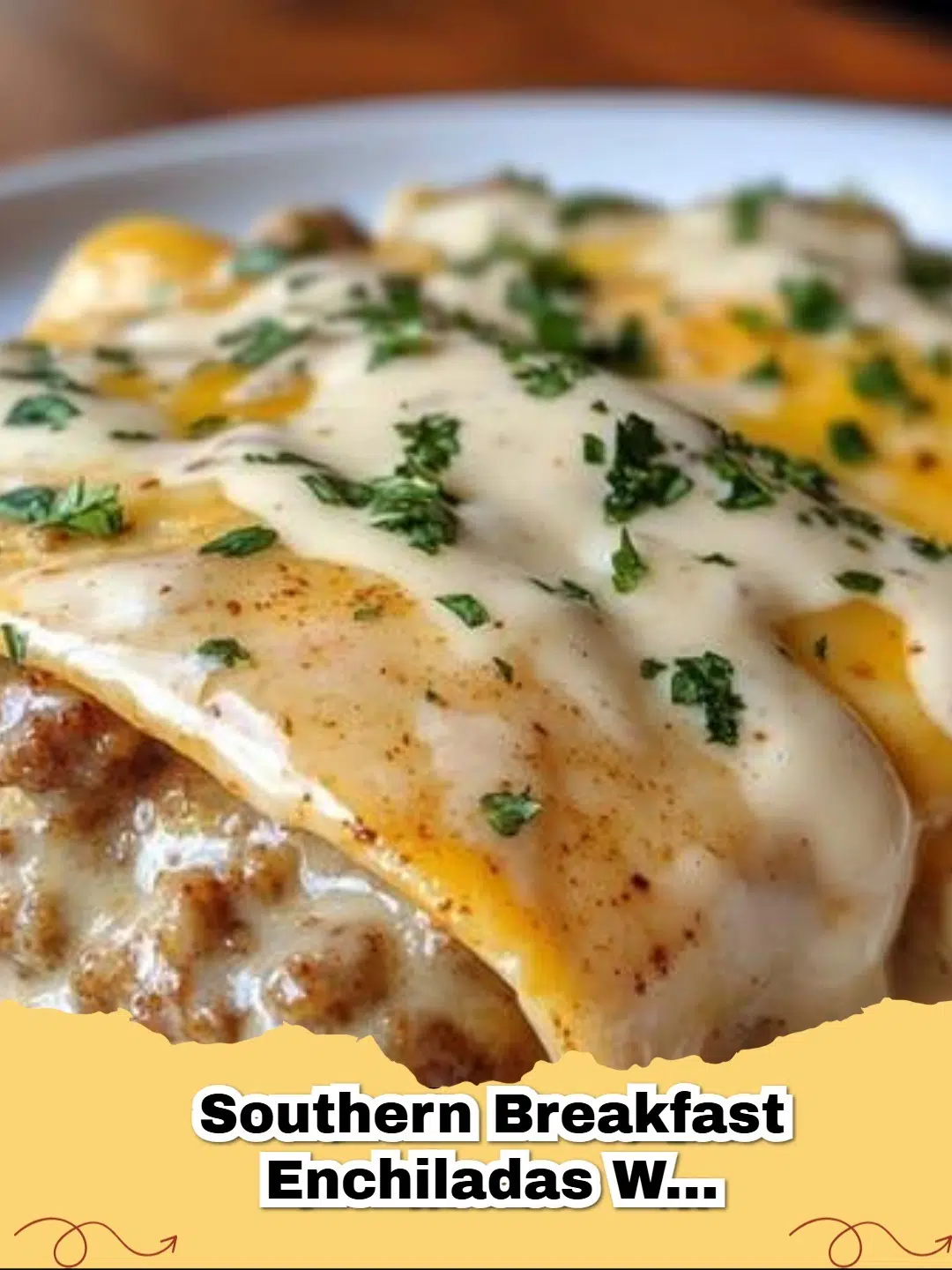 Close-up of bubbling Southern Breakfast Enchiladas with Sausage Gravy, garnished with green onions