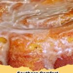 A moist slice of Southern Comfort Sweet Potato Pound Cake on a white plate with a fork.