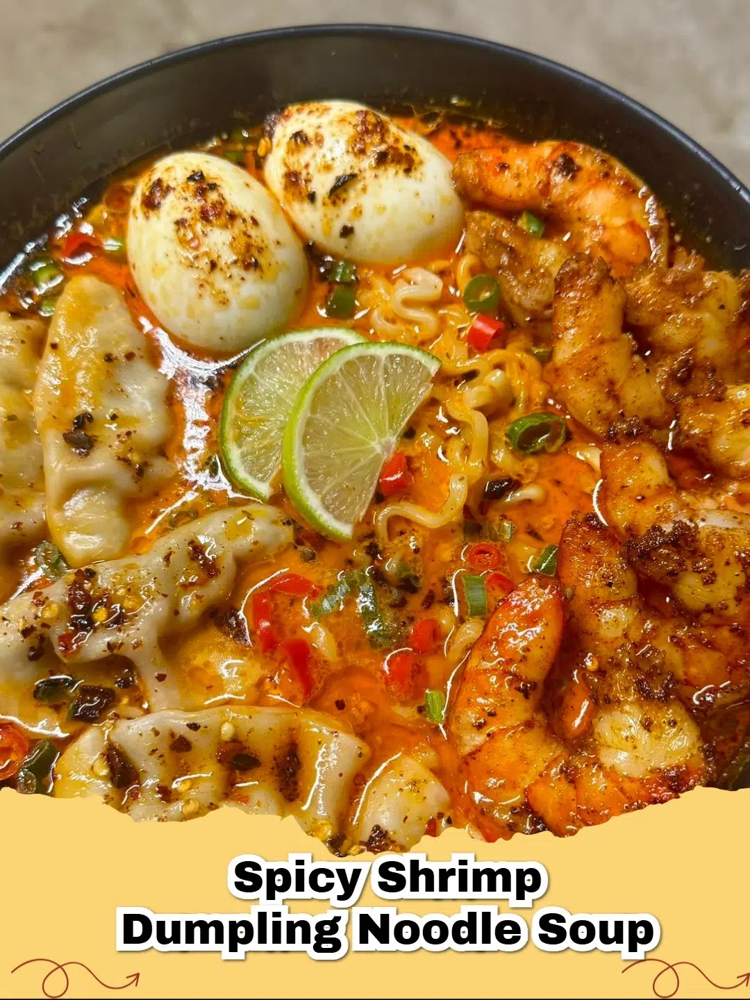 Bowl of spicy shrimp dumpling noodle soup with green onions and cilantro