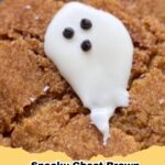 Spooky ghost brown butter pumpkin cookies with white chocolate ghosts and black eyes, perfect for Halloween.