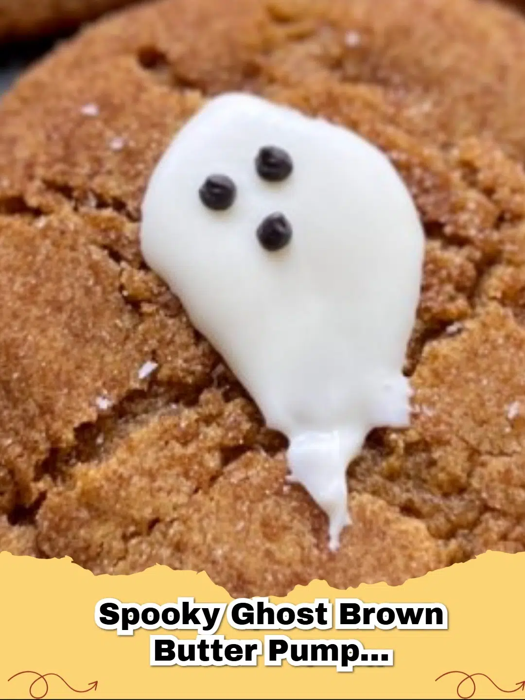 Spooky ghost brown butter pumpkin cookies with white chocolate ghosts and black eyes, perfect for Halloween.