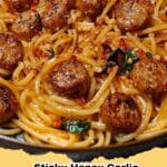 Close-up of Sticky Honey Garlic Sausage Pasta Skillet garnished with fresh parsley, ready to be served.