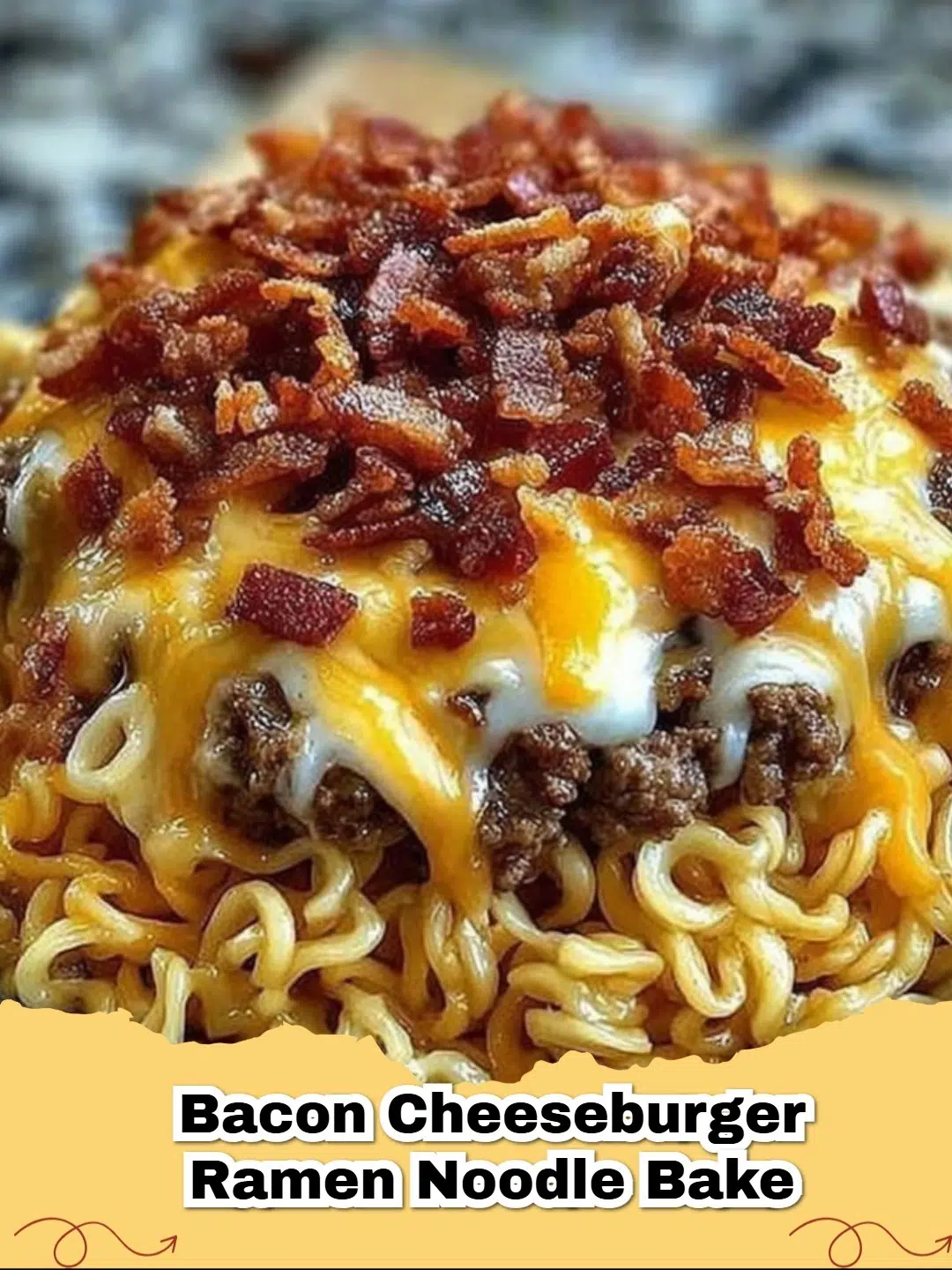 Hearty Bacon Cheeseburger Ramen Noodle Bake fresh from the oven, topped with melted cheddar.