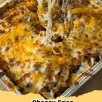 Delicious golden Cheesy Fries Casserole bubbling with melted cheese, garnished with green onions.