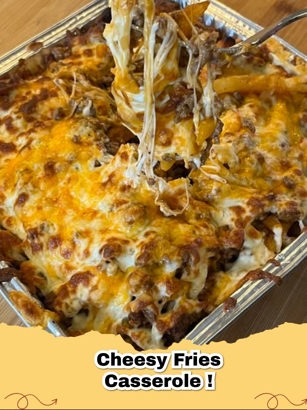Delicious golden Cheesy Fries Casserole bubbling with melted cheese, garnished with green onions.