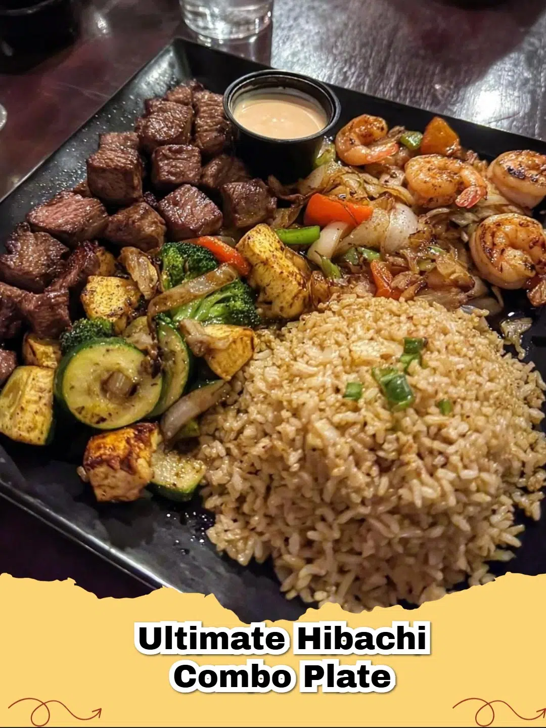 A vibrant Hibachi Steak, Chicken & Shrimp Fried Rice Combo Plate, featuring perfectly seared proteins, savory fried rice, and tender-crisp sautéed vegetables.