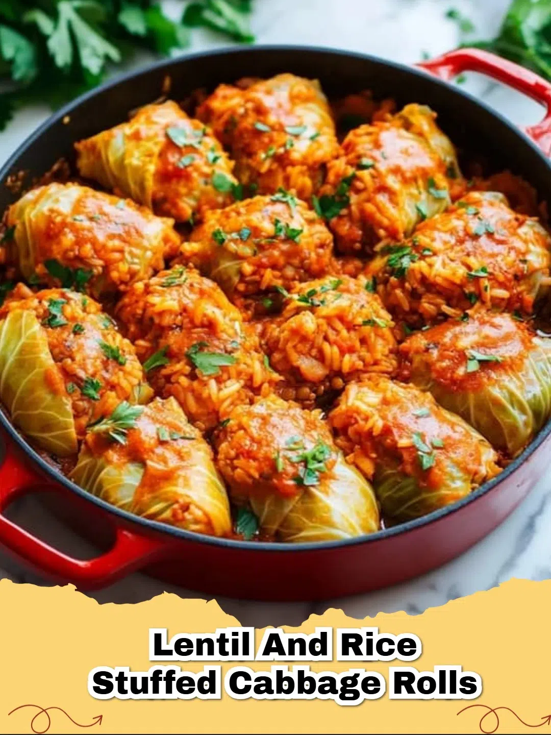 Close-up of baked vegan lentil and rice stuffed cabbage rolls in a rich tomato sauce, garnished with fresh parsley.