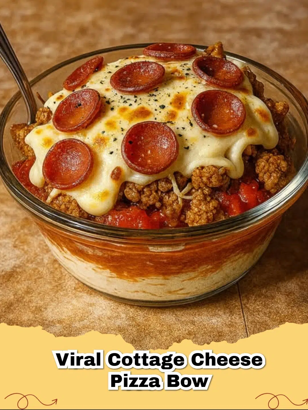 A vibrant, high-protein cottage cheese pizza bowl with melted mozzarella and turkey pepperoni, ready to eat.