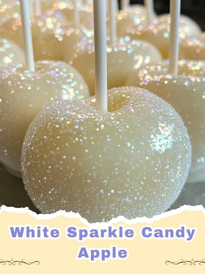 Dazzling white sparkle candy apples with edible glitter on a white background, perfect for a festive occasion.