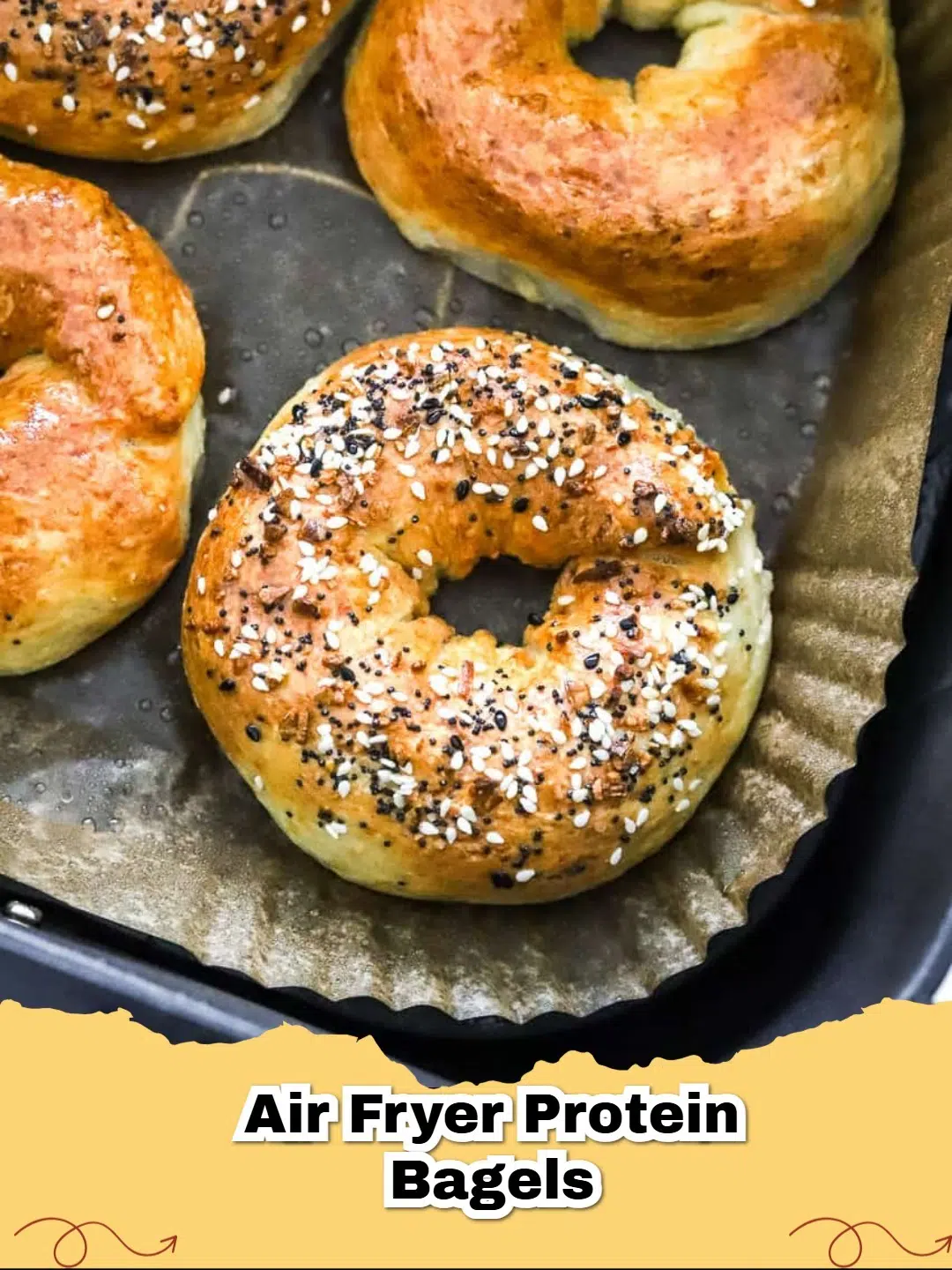 Freshly air-fried cottage cheese bagels topped with everything seasoning, ready to eat.