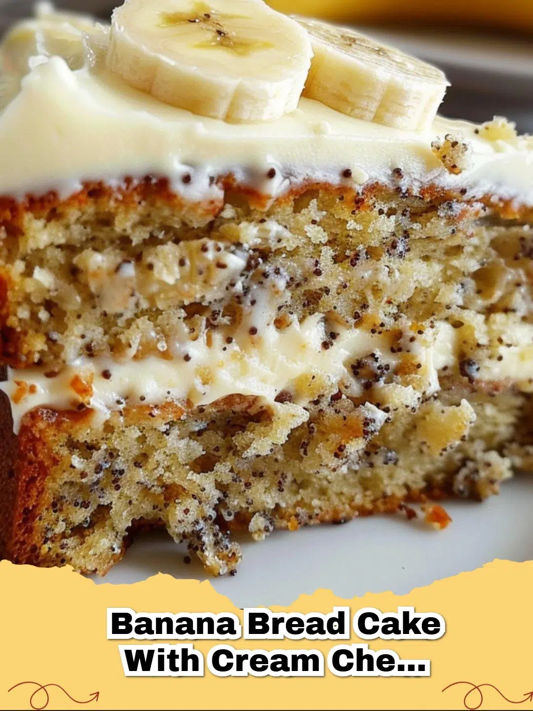 Moist banana bread cake topped with creamy, tangy cream cheese frosting, garnished with a sprinkle of cinnamon.