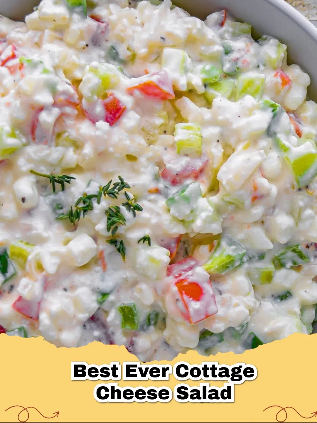 Vibrant bowl of BEST EVER Cottage Cheese Salad with fresh vegetables and herbs, ready to eat.